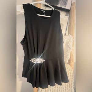 Black peplum top with rhinestone embellishment